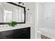 Beautiful bathroom with double sinks, a subway tile shower, and a black framed mirror at 10134 E Talon Ave, Mesa, AZ 85212