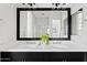 Modern bathroom featuring double sinks, sleek black cabinetry and a glass-enclosed shower at 10134 E Talon Ave, Mesa, AZ 85212