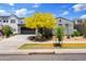 Two-story homes with an attached two car garage and mature landscaping at 10134 E Talon Ave, Mesa, AZ 85212