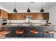 Kitchen island with modern pendant lights and breakfast bar seating at 10134 E Talon Ave, Mesa, AZ 85212