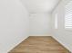 Neutral toned room with wood-look floors and mini-split AC unit at 10134 E Talon Ave, Mesa, AZ 85212