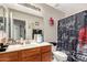Bathroom featuring a single vanity, a large mirror, and a curtained shower at 10320 W Luke Ave, Glendale, AZ 85307