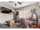 Bedroom with a view, including desk space, display shelving, and natural light at 10320 W Luke Ave, Glendale, AZ 85307