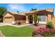 Charming single-story home with a well-maintained lawn and desert landscaping at 10320 W Luke Ave, Glendale, AZ 85307
