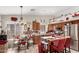 Well-equipped kitchen featuring modern appliances, tile floors, and an adjacent dining area at 10320 W Luke Ave, Glendale, AZ 85307