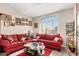 Cozy living room with large window, plush seating, and an area rug at 10320 W Luke Ave, Glendale, AZ 85307