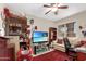 Comfortable home office with a comfortable chair, sofa, and large display screen at 10320 W Luke Ave, Glendale, AZ 85307