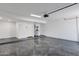 Bright garage features epoxy flooring and a modern garage door opener for added convenience at 10360 N 98Th St, Scottsdale, AZ 85258