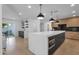 Open kitchen design with a large island and a bar area, perfect for entertaining guests at 10360 N 98Th St, Scottsdale, AZ 85258