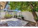 Private courtyard area with planter boxes and drought-resistant landscaping at 10360 N 98Th St, Scottsdale, AZ 85258