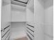 Walk-in closet with built in shelves and drawers offers abundant storage solutions at 10360 N 98Th St, Scottsdale, AZ 85258