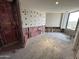 An unfinished bedroom with a large window and walls that are being prepped for renovation at 1040 E Osborn Rd # 602, Phoenix, AZ 85014