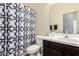 Bathroom with a vanity, a toilet, and shower featuring a decorative shower curtain at 10452 E Natal Ave, Mesa, AZ 85209
