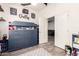 Bedroom with themed décor, built-in shelving and an open doorway into another room at 10452 E Natal Ave, Mesa, AZ 85209