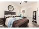 Bedroom with a cushioned headboard, ceiling fan, and natural light entering from the window at 10452 E Natal Ave, Mesa, AZ 85209