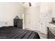 Bedroom featuring a neutral color scheme, ceiling fan, and wood-look tile flooring at 10452 E Natal Ave, Mesa, AZ 85209