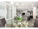 Bright dining room featuring large windows, modern chandelier, and neutral paint at 10452 E Natal Ave, Mesa, AZ 85209