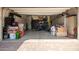 View of a well-organized garage with storage cabinets and ample space at 10452 E Natal Ave, Mesa, AZ 85209