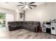 Open concept living room featuring tile floors, neutral paint, and fan at 10452 E Natal Ave, Mesa, AZ 85209