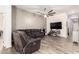 Open concept living room featuring tile floors, neutral paint, and fan at 10452 E Natal Ave, Mesa, AZ 85209