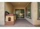 Covered patio with brick pavers, a playhouse, and a sliding glass door at 10452 E Natal Ave, Mesa, AZ 85209