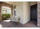 Inviting front patio with stone accents, seating, and stylish decor at 10452 E Natal Ave, Mesa, AZ 85209