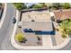 Aerial view featuring a neatly landscaped home with desert accents, a paved driveway, and easy street access at 11210 S Bannock St, Phoenix, AZ 85044