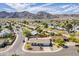 Picturesque aerial shot showcasing well-kept homes, desert flora, and scenic mountain views in a vibrant community at 11210 S Bannock St, Phoenix, AZ 85044