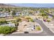 Neighborhood aerial view showcasing well-maintained homes, desert landscaping, and mountain views on a sunny day at 11210 S Bannock St, Phoenix, AZ 85044