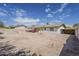 This large backyard boasts a covered patio, mature landscaping, and the entire yard is enclosed by block fencing at 11210 S Bannock St, Phoenix, AZ 85044