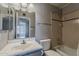 This bathroom features a classic design with a vanity, an over-sized mirror, and a shower-tub combination at 11210 S Bannock St, Phoenix, AZ 85044