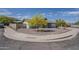 This home features desert landscaping, a mature shade tree, and a circular driveway for easy access and curb appeal at 11210 S Bannock St, Phoenix, AZ 85044