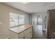Bright kitchen and dining area with an island, stainless steel appliances, and view of outdoor space at 11210 S Bannock St, Phoenix, AZ 85044