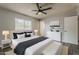 Serene bedroom featuring neutral colors, a ceiling fan, and modern decor at 11210 S Bannock St, Phoenix, AZ 85044