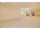 Large living room featuring tile floors and open floor plan with attached kitchen at 1122 E Meadowbrook Dr, Casa Grande, AZ 85122