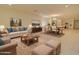 Spacious and stylish living room with elegant furnishings and a dining area at 1122 E Meadowbrook Dr, Casa Grande, AZ 85122