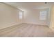 Spacious bedroom featuring neutral carpet, light colored walls, and two windows that provide great natural light at 1123 E Meadowbrook Dr, Casa Grande, AZ 85122