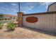 Arroyo Grande community entrance with stone accents, desert landscaping and a rustic metal sign at 1123 E Meadowbrook Dr, Casa Grande, AZ 85122