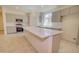 Bright kitchen boasts stainless appliances, grey cabinets, white backsplash, and a quartz countertop island at 1123 E Meadowbrook Dr, Casa Grande, AZ 85122