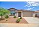 Charming single-story home with a well-manicured front yard, desert landscaping, and neutral exterior paint at 1130 E Atwood Dr, Casa Grande, AZ 85122