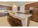 Spacious kitchen features granite countertops, stainless steel appliances, and a large island with seating at 1130 E Atwood Dr, Casa Grande, AZ 85122