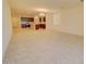 Open-concept living room and kitchen area with neutral tile flooring and bright natural light at 1130 E Atwood Dr, Casa Grande, AZ 85122