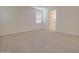 Spacious main bedroom with carpet flooring, a window for natural light, and an en-suite bathroom at 1130 E Atwood Dr, Casa Grande, AZ 85122