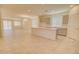 A spacious kitchen with a large island, neutral tones, modern appliances, and ample natural light at 1130 E Meadowbrook Dr, Casa Grande, AZ 85122