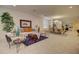 Bright living room open to dining area, featuring stylish furniture, area rug, and lots of natural light at 1130 E Meadowbrook Dr, Casa Grande, AZ 85122