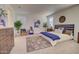 Spacious main bedroom with neutral tones, large windows, walk-in closet, and stylish furnishings at 1130 E Meadowbrook Dr, Casa Grande, AZ 85122