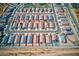 An aerial view highlights a neighborhood featuring tile roofs and well-maintained landscaping at 1142 E Atwood Dr, Casa Grande, AZ 85122