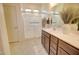 Clean bathroom with a walk-in shower, double vanity with granite countertops, and updated fixtures at 1142 E Atwood Dr, Casa Grande, AZ 85122