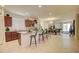 Open-concept kitchen featuring granite countertops, stainless appliances, a kitchen island and adjoining dining area at 1142 E Atwood Dr, Casa Grande, AZ 85122