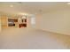 Spacious living room featuring neutral carpet, recessed lighting, and an open layout into the kitchen at 1142 E Atwood Dr, Casa Grande, AZ 85122